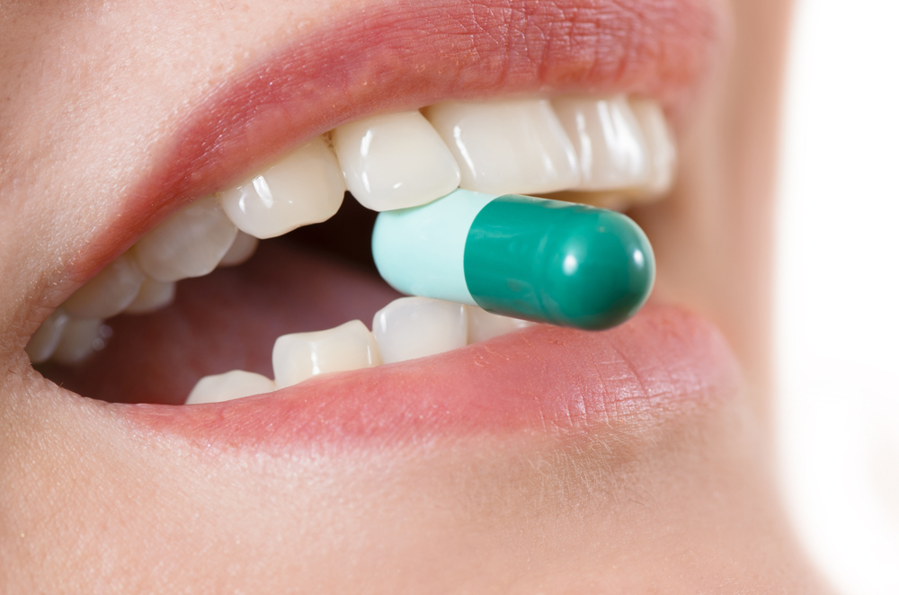 mouth taking pill.jpg